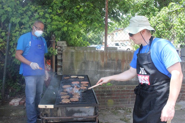 Mr. Mohr and Mr. Depeine tag team the grill